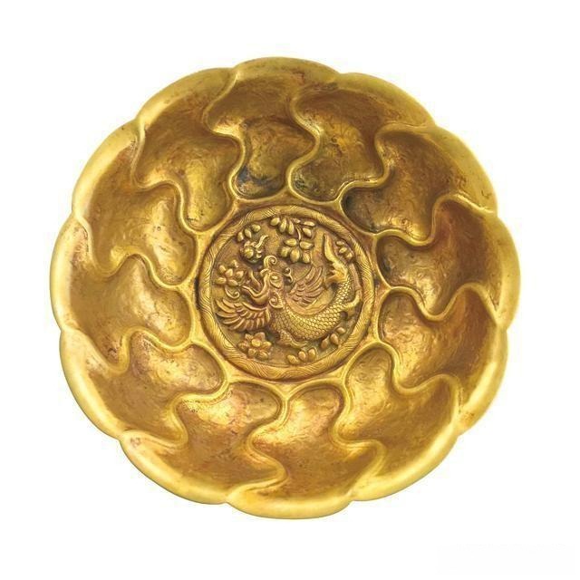 Tang Dynasty gilt silver bowl with Capricorn motif and wave patterns, showcasing intricate traditional craftsmanship