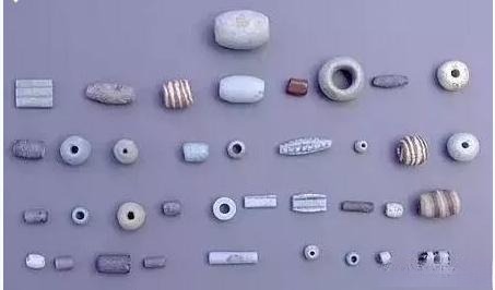 Variety of faience beads, showcasing refined craftsmanship and beauty, widely used and traded in ancient times.