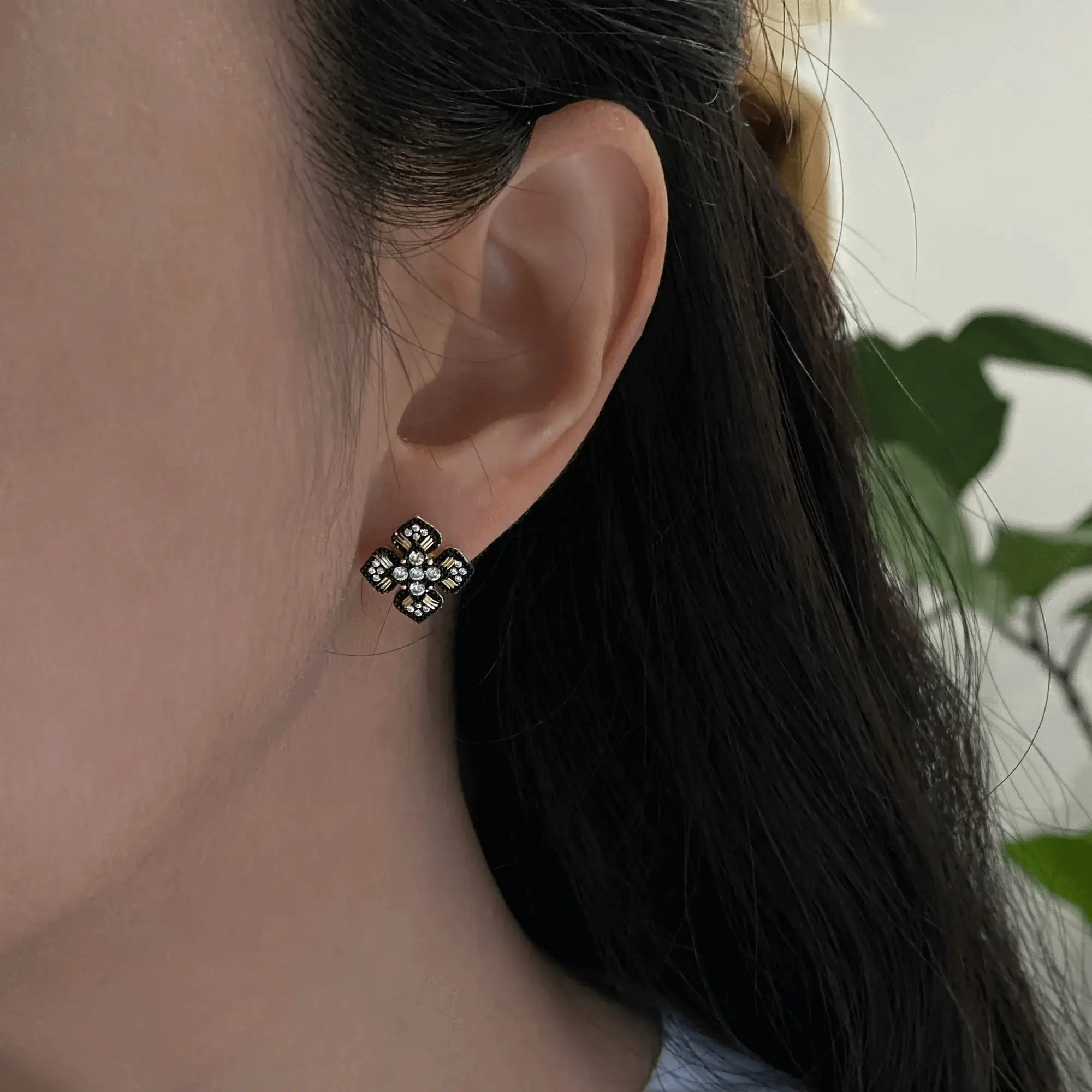 Woman wearing handmade earrings designed for all-day comfort and safe wear on sensitive ears.