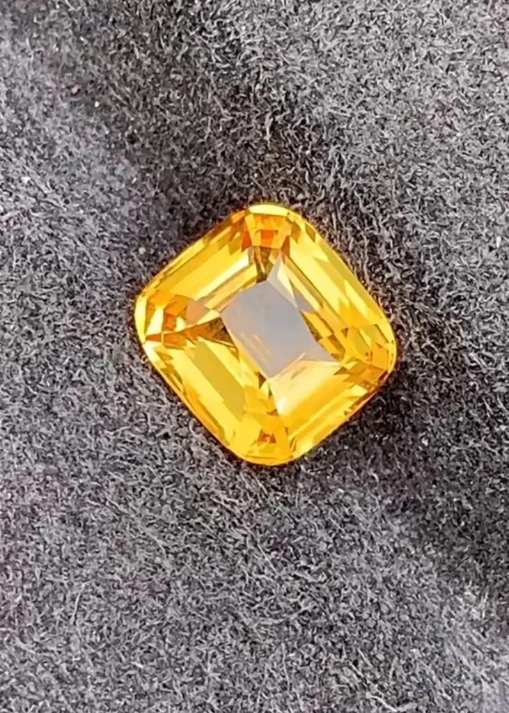 A faceted gemstone that has undergone high-temperature beryllium diffusion treatment.