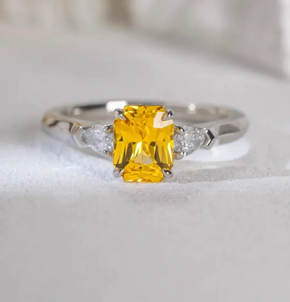 A precision-cut 1.58 carat octagon gemstone set in a handcrafted 18K gold four-prong ring.