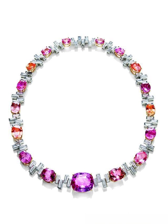 Harry Winston Sunset Necklace featuring a large, rare Padparadscha fancy colored sapphires, showcasing the gem's delicate pink-orange hue.
