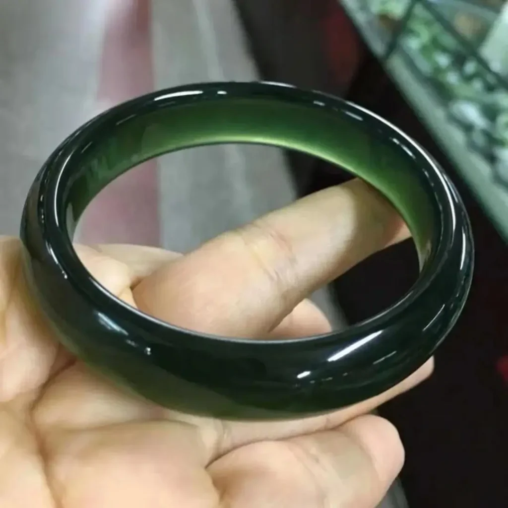 Natural A-Grade Lao Yu bracelet with fine waxy luster, showcasing its vibrant yellow-green color.