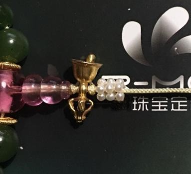 Close-up showing the cord exiting the Pagoda (Buddha Tower) and secured with a tight Diamond Knot.