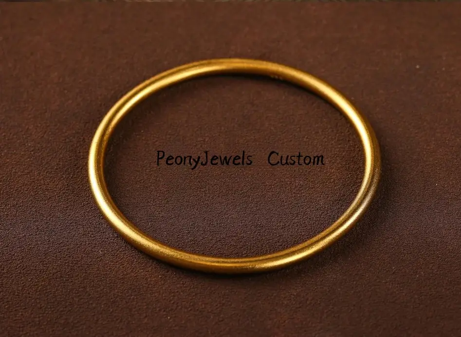 A 68.97g PeonyJewels handmade custom 24K gold bangle demonstrating zero gold recasting weight loss.