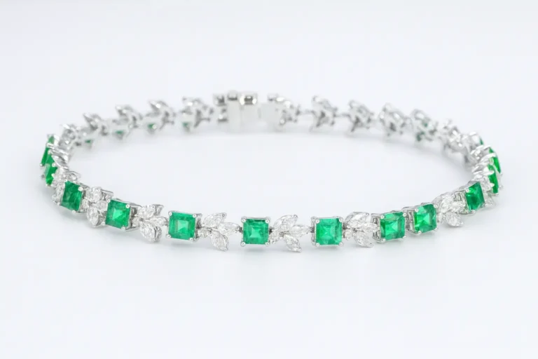 Featured image: Custom 18k gold bracelet by PeonyJewels, meticulously set with natural emeralds and brilliant cut diamonds.