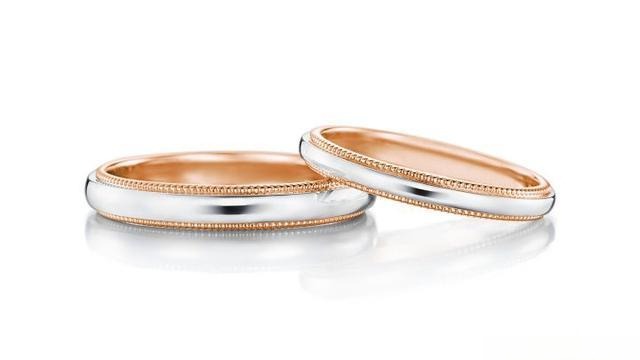 A pair of 18K gold-plated sterling silver rings.