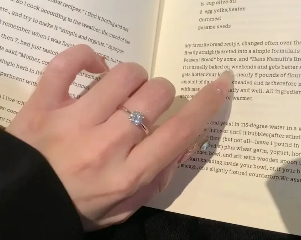 Customer wearing a custom PeonyJewels Moissanite engagement ring, showcasing durability as a strong alternative in the Moissanite vs Diamond debate.