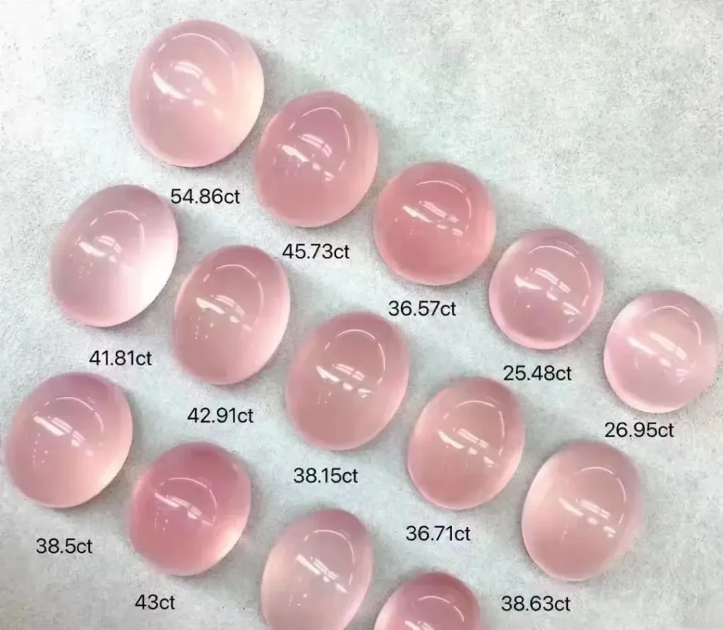 Multiple carat sizes of Rose Quartz cabochons for jewelry.