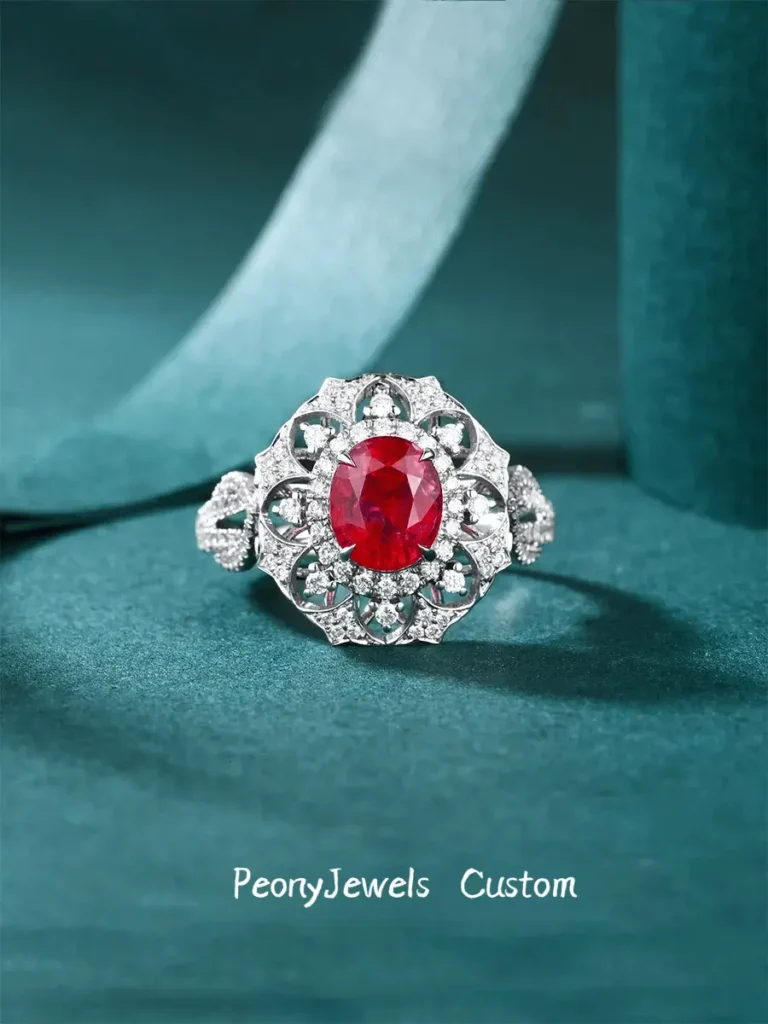 PeonyJewels bespoke 18K gold ring featuring a natural unheated pigeon blood ruby surrounded by diamonds.