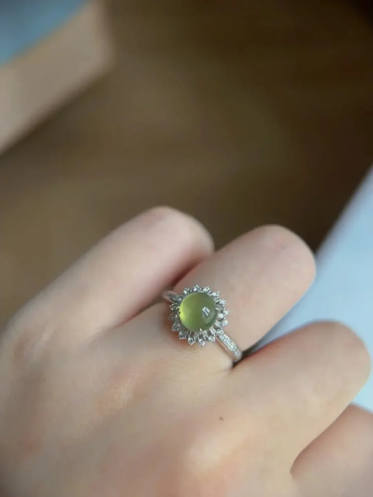 A custom PeonyJewels ring featuring a warm, natural Yellow Jadeite cabochon set in a bespoke jewelry design.