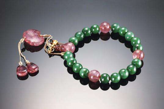 Antique Qing Dynasty Shibazi bracelet featuring eighteen jade beads separated by pink tourmaline drops and a pearl knot.