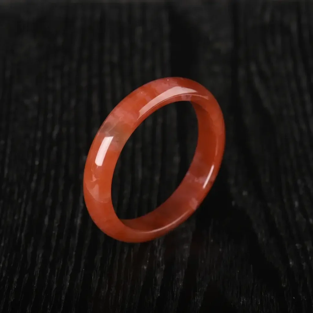 A smoothly polished Southern Red Agate bangle with vivid, consistent red color.