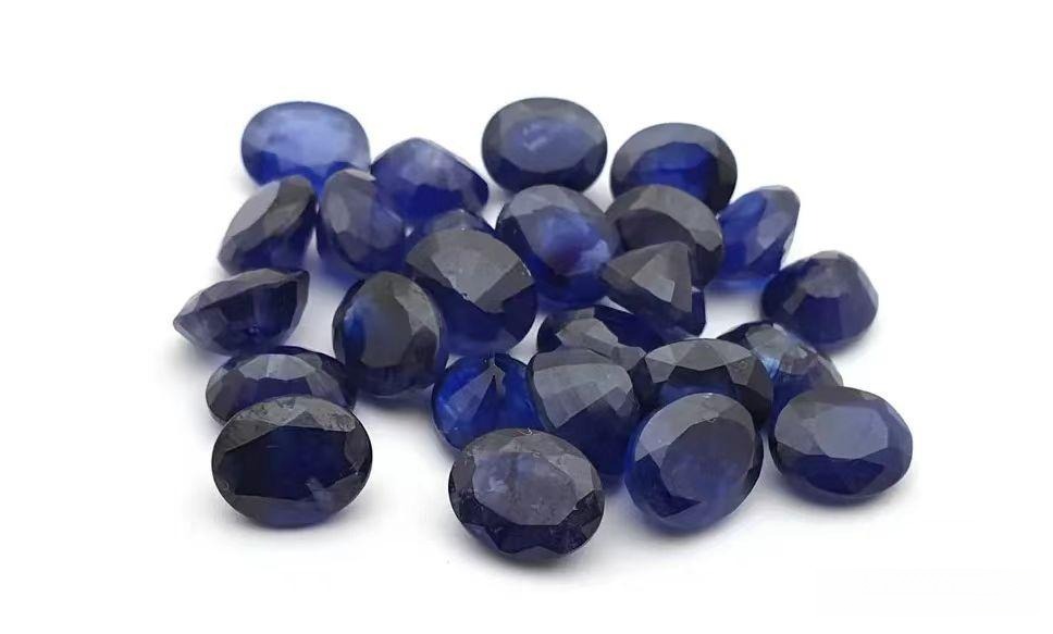 A collection of faceted blue sapphires in various shades, premium Thailand gemstones from local mines.