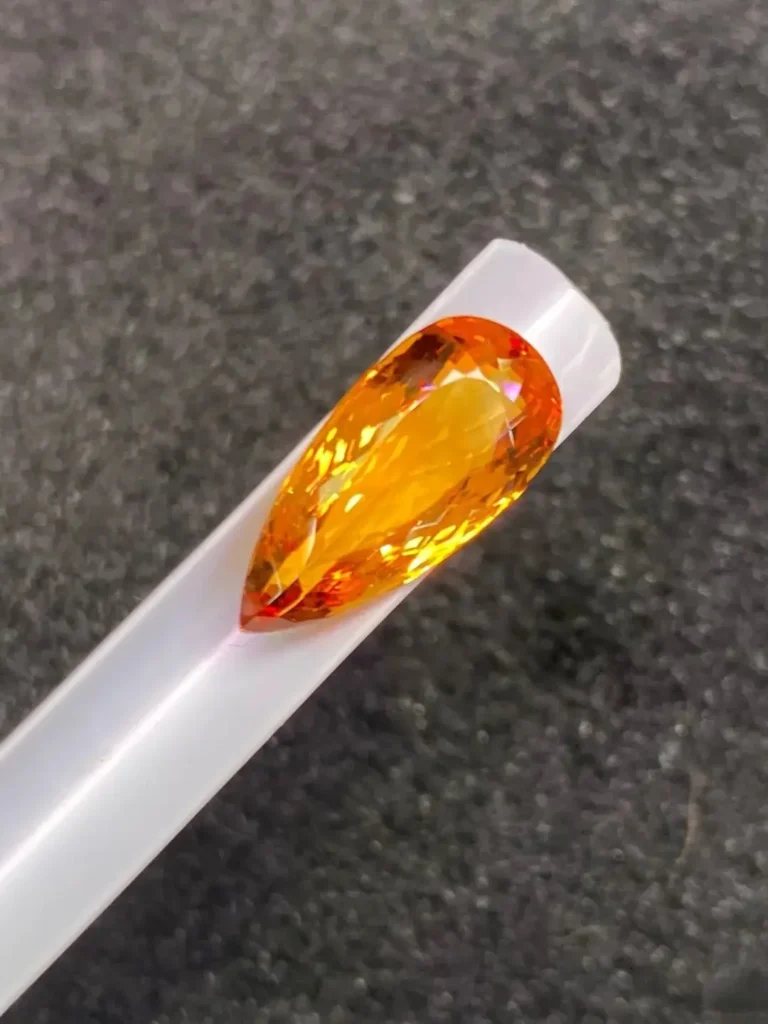 Premium golden-yellow gemstone with exceptional brilliance and a clean, faceted oval structure.