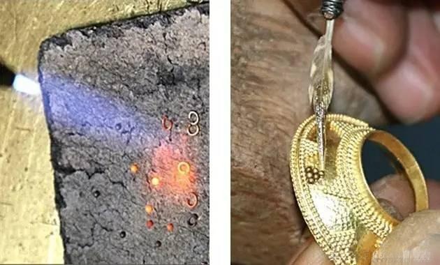 John Paul Miller uses a fine brush to meticulously place gold beads onto a jewelry base.