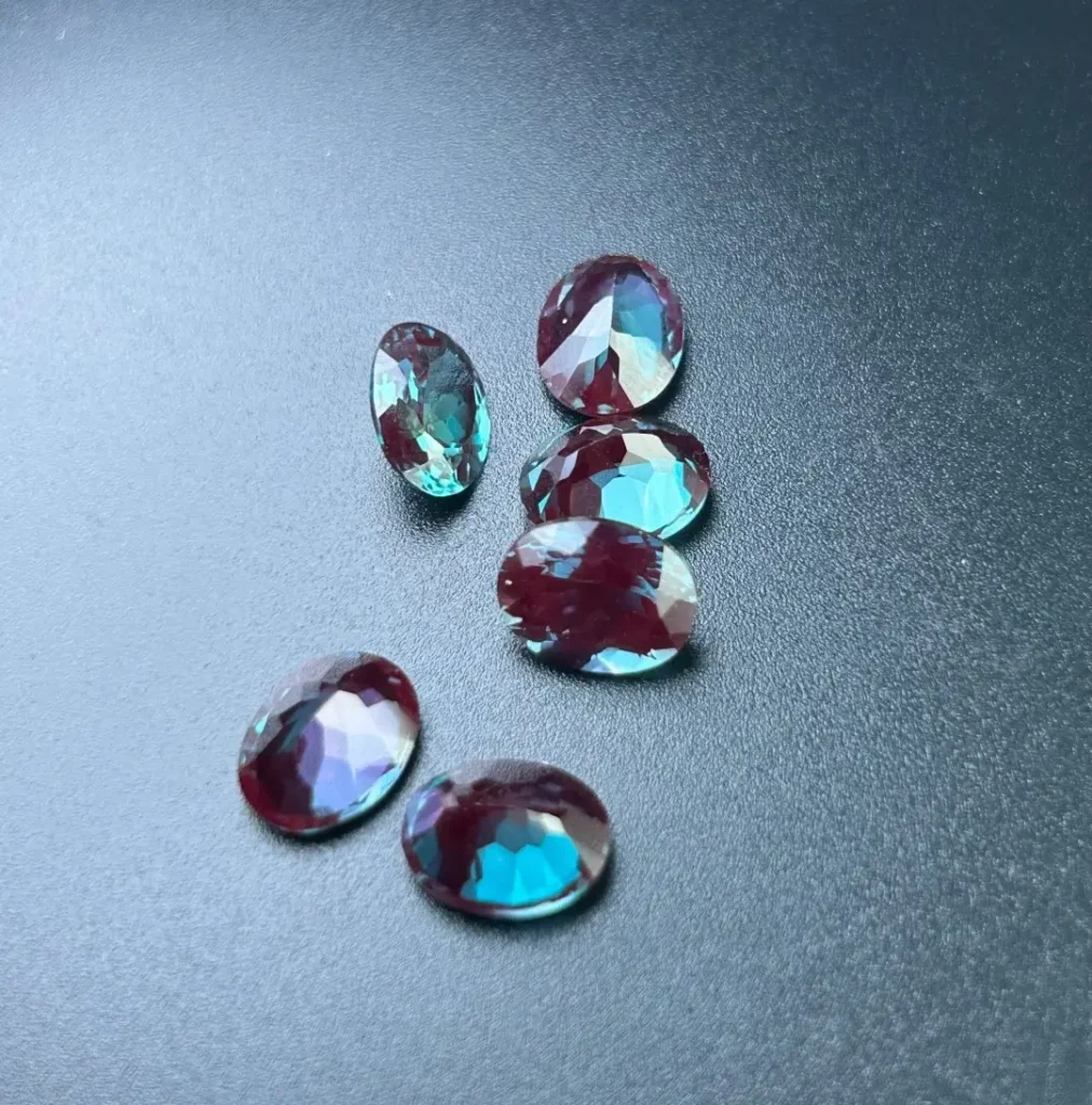 Uniformly clean lab-grown synthetic alexandrite gems showing consistent color-change properties.