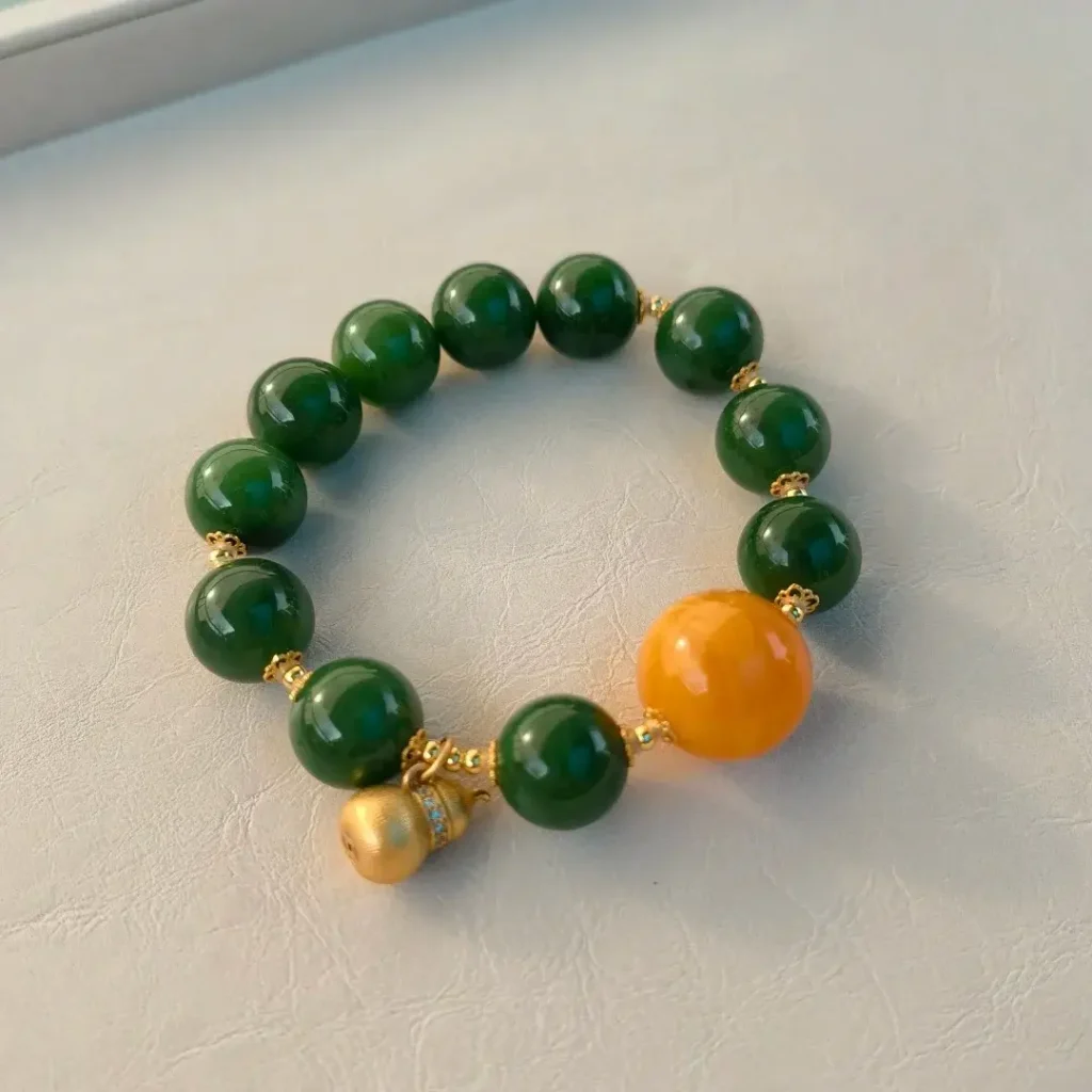 Mine 5 Russian nephrite bracelet with a 16mm cave-flower amber bead and S925 silver spacers.