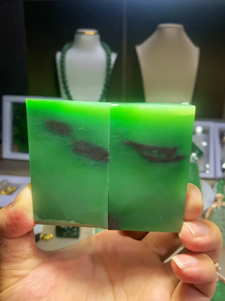 Two Mine No. 7 nephrite slices with reddish-brown skin and characteristic dark brown mineral clusters.