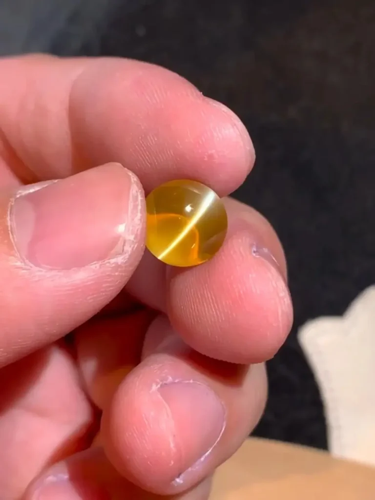 Chrysoberyl with a sharp, centered, and fluid eye line, exemplifying top-quality natural chatoyancy.
