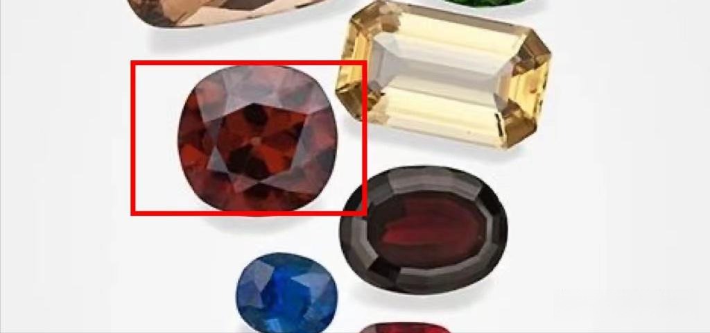 Faceted natural zircons within a red frame, showcasing the fire and luster of Thailand gemstones.