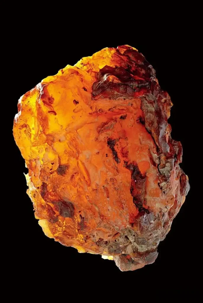 Raw Baltic amber from Kaliningrad, Russia, showing golden yellow hues and natural resin patterns.