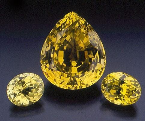 Faceted transparent chrysoberyl gemstone showing exceptional brilliance and honey-yellow fire.